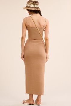 Elevate your style with our chic two-piece ensemble. Made from a luxurious ribbed-knit fabric, this form-fitting set includes a crop top with adjustable straps and square neckline, paired with a high-waisted midi skirt with a front slit. Enjoy comfort and elegance in this must-have outfit. PRE-ORDER 06/07/24 Fabric & fit: 50% VISCOSE 28% POLYESTER 22% NYLON Model is wearing size small. Skirts Midi High Waisted, Swimwear Sale, Square Necklines, Square Neckline, Pre Order, Skirt Set, Ribbed Knit, Knitted Fabric, Knit Fabric