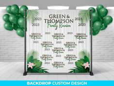 a green and white backdrop with balloons in the shape of palm leaves for a family reunion