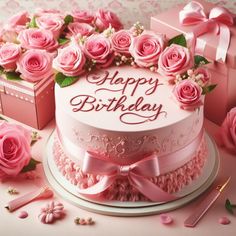 a birthday cake with pink roses on it