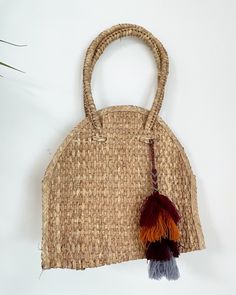 Handwoven palm leaf totes (in Baja) w/ hand made wool tassel from Chiapas SIZE: M PLEASE NOTE: orders ship 2nd week of JULY Natural Color Travel Bags With Tassels, Natural Travel Bags With Tassels, Natural Tassel Shoulder Bag For Daily Use, Natural Shoulder Bag With Tassels For Daily Use, Bohemian Straw Tote Bag With Tassels, Everyday Use Straw Tote Bag With Tassels, Natural Tassel Bag For Everyday Use, Brown Tassel Shoulder Bag For Vacation, Rectangular Natural Shoulder Bag With Tassels