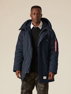 A N-3B mod parka inspired from US Navy jacket detailing. Suit up for winter with a snug parka built to last. The snorkel hood, a classic feature of the N-3B, has been modified to include an adjuster and wire edge. With a water resistant shell, channel-quilted lining, and hand warmer pockets, this US Navy-inspired mod parka is especially suited to the most extreme climates. Male Model Information - Black: Height: 6'0" Size: Large Male Model Information - Gunmetal & Replica Blue: Height: 6'1" Size Blue Winter Techwear Outerwear, Blue Techwear Outerwear For Winter, Blue Techwear Winter Outerwear, Techwear Hooded Jacket With Double-lined Hood For Cold Weather, Techwear Parka With Fleece Lining For Streetwear, Blue Weatherproof Parka For Winter, Blue Nylon Parka With Adjustable Hood, Blue Hooded Techwear Outerwear, Weatherproof Blue Outerwear For Streetwear