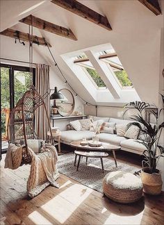 a living room filled with furniture and lots of windows in the skylight above it