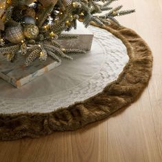 a christmas tree skirt on top of a wooden table