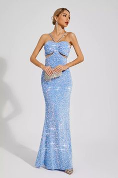 Enhance your elegance with the stunning Artemis Blue Sequins Halter Dress. This long, figure-flattering evening gown features a captivating design adorned with shimmering sequins. Perfect for any special occasion, its halter neckline exudes sophistication.  Length: Approx 155cm Materials: Polyester Gentle Dry Clean Only  The model is 5 ft 7 and wears size S  Color may vary due to lighting on images. The product images (without a model) are closest to the true color of the product.  Item runs true to size chart and is cut to suit our size chart. Please refer to our size chart for the best fit. Do not size up or down. Elegant Halter Neck Sequin Dress For Prom Season, Elegant Halter Neck Sequin Dress For Prom, Evening Halter Neck Sequin Dress For Prom Season, Halter Neck Sequin Dress For Prom Evening, Blue Strapless Sequin Dress For Prom, Embellished Backless Sequin Fabric For Prom, Sparkling Sequin Fabric For Evening Prom, Sparkling Sequin Fabric For Prom Evening, Sequin Halter Neck Party Gown