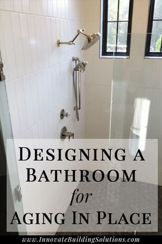 a bathroom with white tile and black flooring that says designing a bathroom for aging in place