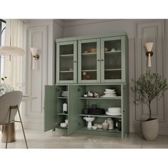 a green cabinet with glass doors in a room