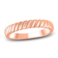 an 18k rose gold wedding band with twisted design on the outside and inside side