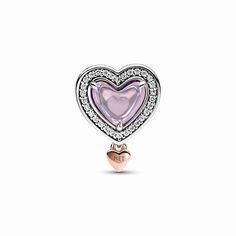 The Two-tone Openwork Mom & Heart Charm is a celebration of all the amazing moms in our lives. This sterling silver openwork heart charm features a pink heart-shaped cabochon stone on one side with an engraved heart on the back visible through the stone, creating a frosted look. On the other side of the charm is the word "M♥M" in sterling silver script with a pink heart-shaped stone as the central letter. Each side of the charm is outlined with clear cubic zirconia pavé, and a pattern of cut-out Pandora Heart Charm, Pandora Rose, Pandora Heart, Bracelet Pandora, Pink Themes, Mors Dag, Small Rose, Pandora Charm, Jewellery Uk