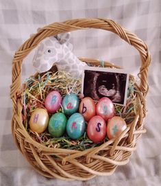 an easter basket filled with eggs and a giraffe figurine