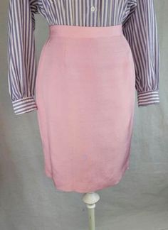 Vintage 90s silk pink pencil skirt in bubblegum pink. Zipper and button back closure. Fully lined. This  piece is in excellect vintage condition without notable flaws or stains. No designer label present. Labeled a size 8. Best fits a modern small.  Waist 27" Hips 38" Top to bottom 21.5" For more specific photos or measurements please message me, happy to provide. Office Pencil Skirt In Pink, Pink Pencil Skirt For Office, Pink Fitted Knee-length Pencil Skirt, Formal Pink Pencil Skirt, Formal Pink Midi Skirt, Pink Lined Skirt For Office, Pink Pencil Skirt For Workwear, Pink Lined Knee-length Pencil Skirt, Pink Feminine Skirt For Formal Occasions