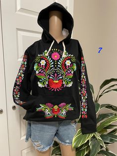 "Amazing pullover sweaters! Embroidered Mexican Sweaters.. Size MEDIUM  Each sweater has its unique design - Cotton Material Beautiful Floral Authentic Sweater from Chiapas, Mexico. Our Mexican Partners take pride in their work, and these is one of their best pieces. All the embroidered work has a professional and skilled finish. CARE DETAILS: Hand wash only Delicate care Hang dry Don't miss out, make a very special gift for a very special friend, or buy it for you for that special celebration. Black Embroidered Long Sleeve Sweater, Black Long Sleeve Embroidered Sweater, Embroidered Hooded Sweatshirt For Spring, Hooded Embroidered Sweatshirt For Spring, Floral Embroidery Long Sleeve Hoodie For Fall, Casual Winter Sweater With Floral Embroidery, Embroidered Hooded Sweatshirt For Winter, Hooded Embroidered Sweatshirt For Winter, Casual Embroidered Winter Tops