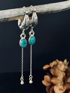 **Adorn your ears with the vibrant elegance of our sterling silver hoop earrings, featuring a charming turquoise gemstone as the centerpiece. The hoops are crafted from high-quality sterling silver, offering a timeless look that complements any style. The turquoise gemstone adds a pop of color and a touch of bohemian flair, making these earrings the perfect accessory for any occasion. Whether you're dressing up for a night out or adding a chic accent to your everyday ensemble, these earrings are Teardrop Turquoise Nickel-free Hoop Earrings, Turquoise Teardrop Nickel-free Hoop Earrings, Nickel-free Teardrop Turquoise Hoop Earrings, Nickel-free Turquoise Teardrop Hoop Earrings, Turquoise Sterling Silver Hoop Earrings For Pierced Ears, Turquoise Teardrop Hoop Earrings Nickel Free, Nickel-free Turquoise Dangle Hoop Earrings, Turquoise Sterling Silver Nickel-free Hoop Earrings, Turquoise Dangle Hoop Earrings Nickel Free