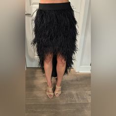 Black Feathered High-Low Skirt, Never Worn With Price Tags Still Attached. Perfect For A Night Out On The Town With Its Glamorous Design And Unique Feather Detailing. Elegant Feather Trim Bottoms For Summer, Chic Summer Bottoms With Feathers, Chic Feathered Bottoms For Summer, Black Asymmetrical Skirt For Party, Elegant Tiered Skirt Bottoms For Party, Party Black Long Skirt Bottoms, Black Party Long Skirt, Party Long Black Skirt, Black Tiered Maxi Skirt For Party