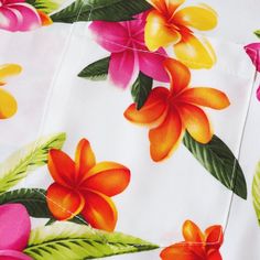 A playful display of colorful plumeria flowers found throughout Hawaii evokes happy memories of fun & laughter on this popular Hawaiian shirt. Enjoy our authentic Hawaiian aloha shirt in soft, lightweight rayon poplin. Our Hawaiian shirts are always designed & made proudly in Hawaii, USA. Spread collar Short sleeves Front button closure Allover floral print Genuine coconut buttons Print-matched left chest pocket Straight hems Size: S - 2XL Poplin Rayon Made in Hawaii, USA Size Chart in Inches Sh White Floral Print Hawaiian Shirt For Spring, White Printed Hawaiian Shirt For Spring, Spring White Printed Hawaiian Shirt, Spring White Hawaiian Printed Shirt, White Tropical Hawaiian Shirt With Short Sleeves, White Hawaiian Shirt With Hibiscus Print For Vacation, White Tropical Hawaiian Shirt With Hibiscus Print, Tropical White Hawaiian Shirt With Hibiscus Print, White Summer Hawaiian Shirt For Vacation