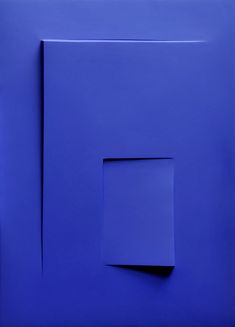 an abstract blue painting with square and rectangle shapes