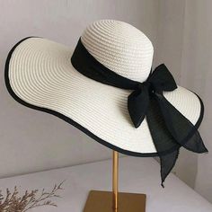 Boho Floppy Beach Hat With Bow * Black And White * Adjustable * Lightweight * Hat Arrives Folded * 60% Polyester 40% Polyvinyl Chloride * Foldable * Comes Folded * One Size 22.8 Crown * Do No Wash Black Wide Brim Sun Hat For Pool, Adjustable Black Straw Hat For Pool, Black Wide Brim Hat For Pool, Black Summer Hats For Pool, White Curved Brim Hat For Pool, Black Summer Pool Hat, Summer Black Pool Hat, Black Summer Straw Hat For The Pool, Black Summer Straw Hat For Pool