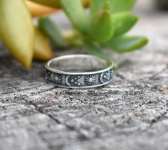 "Moon, Sun, & Star Band: -Solid .925 sterling silver -Measures 5mm wide -Comfortable and easily stackable! -Available in US sizes 4-10.5 with half sizes. More rings here: https://www.etsy.com/shop/AWildViolet?ref=seller-platform-mcnav&section_id=13958646 Looking for a last minute or unique Christmas gift? Visit our \"READY TO SHIP\" section here, ships out in one business day https://www.etsy.com/shop/AWildViolet?section_id=23587515 Connect with us on Instagram @a_wild_violet for sales and givea Adjustable Mystical Sterling Silver Rings, Adjustable Celestial Star-shaped Rings, Celestial Open Ring With Moon Phase Detail, Celestial Moon Phase Open Ring Jewelry, Celestial Moon Phase Open Ring, Adjustable Moon Shaped Celestial Rings, Adjustable Sun And Moon Design Jewelry For Promise Ring, Adjustable Moon-shaped Celestial Rings, Sterling Silver Moon Shaped Celestial Rings