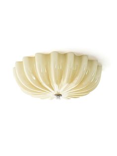 a white ceiling light on a white wall