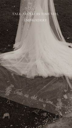 the back of a bride's wedding dress and veil with words written on it