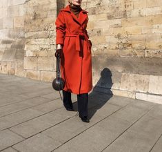 Classy Red Maxi Wool Trench Coat for Women With this gorgeous maxi red wool coat, you can step into the season in style and make a statement come winter. This long wool coat, which combines warmth and style, is an essential piece of clothing for every winter outfit. Women's Trench Coat: A classic trench cut especially for ladies. Maxi Red Coat: A full-length maxi silhouette in a striking shade of red. Wool Coat: Made from the finest wool for the utmost in coziness and warmth. Long Wool Coat: Kee Red Wool Coat For Spring Workwear, Elegant Red Wool Coat For Winter, Long Red Outerwear For Work, Red Long Outerwear For Work, Elegant Red Winter Outerwear, Red Wool Coat For Winter Formal, Red Wool Coat For Winter Formal Events, Chic Long Red Outerwear, Chic Red Long Outerwear