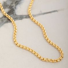 Meticulously crafted from solid 14 karat yellow gold, the 3mm Round Box Chain exudes timeless elegance and sophistication. This intricately crafted chain features a smooth design that enhances its natural luster, creating a captivating shine with every movement. Designed to be the perfect gold necklace for men, its solid and durable links promise long-lasting strength and comfortable wear for any occasion. Whether worn on its own or with a pendant, this chain's rounded design offers a refined to Luxury Jewelry With Rolo Chain, Timeless Link Chain Necklace For Anniversary, Elegant 14k Gold Rectangular Chain Necklace, 14k Gold Box Chain Necklace With Rectangular Links, Yellow Gold Jewelry With Rectangular Rolo Chain, Yellow Gold Necklaces With Oval Link Box Chain, Luxury Tarnish Resistant Chain Necklace With Rectangular Links, Classic Gold Rolo Chain Necklace, Yellow Gold Necklace With Oval Link Box Chain