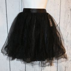 My Michelle Black Tulle Skirt In A Juniors Size Medium. New With Tags, This Has 2 Layers Of Tulle Over The Polyester Inner Liner. Has Zip Back Closure. This Is A Hand Wash Item. Flat Measurements Are Approx. 13-13.5" Across Waist, 20" Waistband To End Of Tulle However This Is Very Full And That Made An Accurate Length Difficult To Get, I Judge This As Knee Length Or Just Above Depending On Body Shapes As Some People Have Longer Legs/Longer Torsos Etc. Great New Condition. Cute For Dances/Dates Black Tulle Skirt, Longer Legs, Tulle Skirt Black, Black Tulle, Long Torso, Long Legs, Some People, Body Shapes, Tulle Skirt