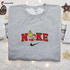 Introducing the Grinch and Cindy Lou x Nike Christmas Embroidered Sweatshirt! Get into the festive spirit with this limited edition collaboration. Crafted with premium quality materials, this sweatshirt features intricate embroidery of Grinch and Cindy Lou, adding a touch of holiday magic to your wardrobe. Stay cozy and stylish this Christmas season. Perfect for gifting [...] Nike Cartoon, Disney Character Shirts, Nike Inspired, Best Family Gifts, Cindy Lou, Limited Edition Shirt, Cartoon Sweatshirts, Merry Christmas Shirts, Jason Voorhees