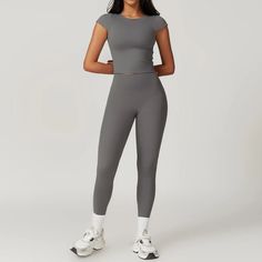 Unleash your inner slayer with the Hermera T-Leggings Set. Whether you're hitting the gym or relaxing at home, these high-waisted leggings offer both support and comfort. The full-length top has a high neckline and a shelf bra with removable padding, providing a tailored fit. Elevate your workout wardrobe with this stylish set! Product Details: Nylon/Spandex 2 Piece Set High-waist legging Top with cap sleeves, waiste length Built in shelf bra with removable padding Imported Workout Wardrobe, Leggings Set, Built In Shelves, Short Leggings, A Shelf, Shelf Bra, Workout Accessories, 2 Piece Set, High Neckline