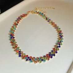 Multicolor Rhinestone Necklace With Sparkling Stones For Party, Multicolor Metal Rhinestone Necklace For Party, Party Multicolor Rhinestone Necklace, Multicolor Crystal Necklace With Rhinestones, Multicolor Crystal Choker Jewelry, Multicolor Crystal Rhinestone Necklace With Sparkling Stones, Trendy Crystal Rhinestone Choker Necklace, Multicolor Crystal Necklaces For Parties, Multicolor Jeweled Choker Necklace