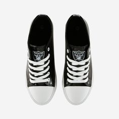 You’re the heart and “sole” of your fanbase, there's no doubt about that. Now, get ready to prove it to everyone at the tailgate or the game with a pair of Las Vegas Raiders Women's Metallic Canvas Sneakers on your feet. Features Team logo display on side and tongue of shoes, in case there were any doubts where your allegiances lie Team-colored, metallic canvas texture to help your style stand out on gameday Closed, round-toe design to protect your fan feet from the elements White laces so you c Logo Display, Las Vegas Raiders, Prove It, Canvas Texture, Toe Designs, Canvas Sneakers, Face Cover, Straw Hat, Team Colors