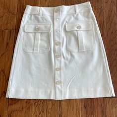 Loft. White Skirt. Nwt. Size 6. Two Lg Front Pockets W Buttons To Match 7 Of Front Opening. 5 Belt Loops:2 Front:3 Back. Opening 1 1/2”. No Elastic In Waist. 1 3/4” Slits At Each Side Seam At Hem. Skirt 21” Long Waist 15” As Shown. Care And Composition Shown. Smoke Free Home. $20. Classic White Skirt With Pockets, White Skirt With Button Closure For Work, Grey Mini Skirt, Navy Blue Skirt, Leopard Print Skirt, Animal Print Skirt, Black And White Skirt, Hem Skirt, Linen Skirt