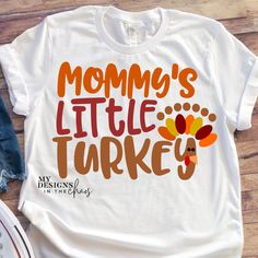 a t - shirt that says mommy's little turkey on it