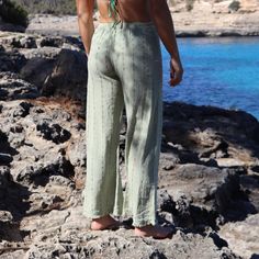 An infusion of long summer nights and endless style! The Santanyi Trouser is a key comfort piece to your Summer 2024 wardrobe with pinstripe detail and a burst of Tucca Swim colour. This is a one-size product with a loose fit.  Style also available on Tucca Swim. 50% Cotton, 50% Linen Green Linen Beach Pants, Bohemian Straight Leg Summer Bottoms, Relaxed Green Summer Pants, Relaxed Green Pants For Summer, Green Linen Beach Bottoms, Summer Loungewear Straight Leg Pants, Straight Leg Summer Loungewear Pants, Green Ankle-length Beach Bottoms, Green Relaxed Fit Beachwear Bottoms