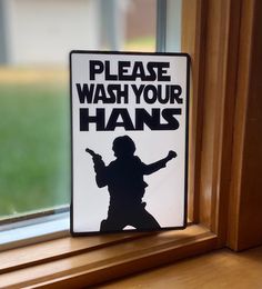 a sign that says please wash your hands on the side of a window sill