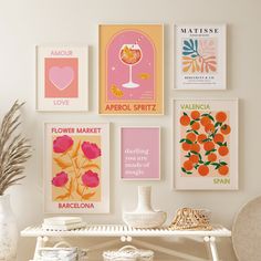 a white table topped with posters and vases