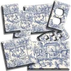 blue and white porcelain switchplate covers with toiler images on the front, back and sides