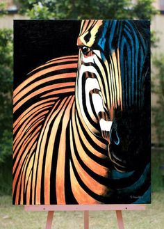 an easel with a painting of a zebra on it's side and trees in the background