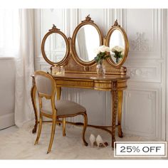 an antique vanity with two mirrors and a chair