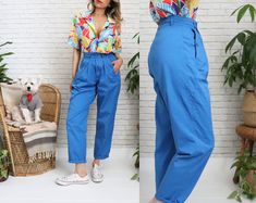 Vintage 1980's cotton summer pants by Lady Forsyth! ➳ Ultra high banded waist with half cinch elastic back waistband for comfort ➳ Flattering silhouette ➳ Two roomy front pockets with secure button closures ➳ Front zipper closure ➳ Pleated front detailing  ➳ Tapered legs ➳ Versatile style looks great rolled up ➳ Perfect summer pants to pair with blouses, tees, or crop tops!  Measurements   Estimated fit: 26 to 27 waist  ✿ please go by measurements below  ✿ ( Taken laying flat )  Waistband: 13.25 Retro High Rise Pants For Summer, Retro Summer Pants With Pockets, Vintage Summer Pants With Relaxed Fit, Vintage Relaxed Fit Summer Pants, Vintage Relaxed Fit Pants For Summer, Vintage Summer Pants With Belt Loops, Retro Tapered Leg Summer Pants, Vintage Blue Pants With Relaxed Fit, Retro Relaxed Fit Summer Pants