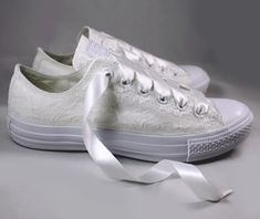 "Monochrome White Bridal Converses --Lace Converse -- Wedding Tennis shoes - Wedding Converse For the girl who wears her Converses to every occasion.... why shouldn't you wear them to your wedding? Skip down the aisle in comfort in these beautiful white lace Converses! Pictured in white with white lace and White ribbon shoelaces. Alternate ribbon shoelace colors are available upon request. Also available in ivory or champagne lace upon request. Available in all colors and styles that Converse cu White Lace-up Wedding Shoes With White Laces, White Lace-up Wedding Shoes, Low-top Wedding Shoes With White Laces, White Lace-up Wedding Shoes For Bridal Shower, Lace-up Lace Wedding Shoes, White Lace-up Lace Wedding Shoes, Round Toe Lace Wedding Shoes, Round Toe Wedding Shoes With Laces, Lace-up Wedding Shoes With Laces