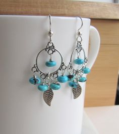 Turquoise and Silver Leaf Earrings, Chandelier Hoop Earrings, December Birthstone Gift, Handmade Earrings Silver, Blue Turquoise Earrings **ABOUT THESE EARRINGS** **SEE MEASUREMENTS BELOW** ❤️These super fabulous boho inspired earrings feature five hand wrapped blue Arizona Kingman Turquoise rondelles warpped to each sterling silver chandelier. I have added sterling silver leaves to the center of each earring and dropped all of these luscious elements from sterling silver ear wires. These beauti Turquoise Dangle Hoop Earrings, Silver Leaf Earrings, Silver Chandelier, Earrings Chandelier, Silver Leaves, Garnet Earrings, Birthstone Gifts, Stylish Earring, Silver Engraving