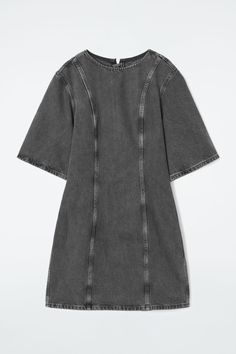 This paneled mini is our womenswear team's contemporary take on '60s shift dresses. It's crafted from organic- and recycled-cotton denim and has a round neck, vertical seam detailing and a lengthened zip pull. Complement the short hemline by styling it with knee-high boots. Slim fitZip closureOrganic cotton is grown from non-genetically modified seeds without chemical fertilizers or pesticides Shell: 80% Organic cotton, 20% Recycled cotton. Excluding trims / Machine wash Back length of size 6 is 32.87" / Model wears a size 6 60s Shift Dress, Cos Dress, Shift Dresses, Women Magazines, Genetically Modified, Denim Shirt Dress, Denim Mini Dress, Poplin Shirt, Denim Mini