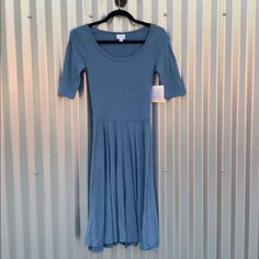 Lularoe Nicole Dress. New With Tags. Size Xs. Blue Heathered. Blue Fitted Modest Midi Dress, Georgia Dress, Short Sleeve Floral Dress, Lularoe Nicole Dress, Black Skater Dress, Lularoe Amelia Dress, Lularoe Julia Dress, Geometric Print Dress, Amelia Dress