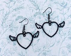 Black heart earrings, black heart jewellery, angel earrings, angel jewellery, devil earrings, devil jewellery, gothic earrings, gothic gifts Materials * 20mm black heart charm * Black earring hooks * light weight * rubber stoppers for back of earrings * earring length 2 inches Why not have a go at the LUCKY DIP https://www.etsy.com/listing/1095282417/charm-necklace-jewellery-lucky-dip-charm Add on a PERSONALISED GIFT BOX  https://www.etsy.com/listing/1170103232/add-gift-boxes-to-your We purchase Black Emo Earrings For Gift, Black Fairy Grunge Jewelry For Gift, Black Fairy Grunge Jewelry Gift, Fairy Grunge Black Jewelry Gift, Gothic Black Heart-shaped Earrings, Handmade Black Fairy Grunge Jewelry, Black Heart Earrings, Heart Jewellery, Earrings Gothic