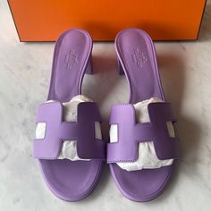 Herms Oasis Sandal In Lilac Size 36.5 Never Ever Worn Luxury Purple Sandals With Open Heel, Designer Purple Sandals For Summer, Luxury Purple Open Toe Sandals, Designer Purple Open Heel Sandals, Luxury Summer Slip-on Heels, Luxury Round Toe Heels For Vacation, Designer Purple Open Toe Sandals, Luxury Heels With Round Toe For Vacation, Luxury Round Toe Purple Sandals