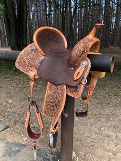 a saddle is sitting on top of a pole