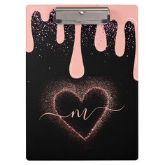 a clipboard with the word love written on it and dripping hearts in front of it