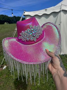 Show stopping Handmade heavy embellished Cowgirl Hat. Pink Iridescent cowgirl hat with luxury jewelled front and diamante dangle trimming. Great for festivals, concerts, parties One Size fits all - Adults Cowboy hat / cowgirl hat / embellished hat / white hat / pink hat / diamante hat / bridal hat / festival Hat Boxed delivery via courier Western Rodeo Outfits, 30th Bday Party, Cowboy Hut, Cowgirl Accessories, Chapeau Cowboy, Bridal Hat, Pink Iridescent, Rodeo Outfits, Festival Hat