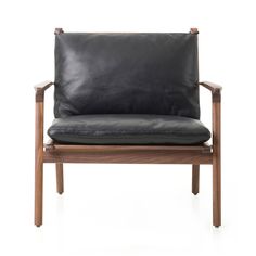 a black leather chair with wooden frame and arm rests on a white background, the back is