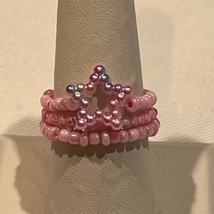 This Handmade Set Includes Three Ring. All Of Them Are Stretchy So As To Fit Most Sizes. A715 Adjustable Star Shaped Jewelry With Spacer Beads, Adjustable Star-shaped Jewelry With Spacer Beads, Adjustable Beaded Rings For Parties, Adjustable Beaded Party Rings, Trendy Star Shaped Beaded Jewelry, Trendy Star-shaped Beaded Jewelry, Pink Beaded Rings For Gift, Star-shaped Beaded Jewelry For Party, Handmade Pink Star-shaped Jewelry